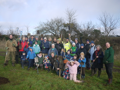 Volunteers planting the new orchard